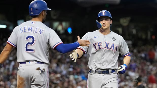 Rangers' Corey Seager, right, celebrates with Marcus Semien after both scored on Seager's home run in Game 4 of the 2023 World Series